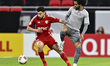 Akram Afif of Al Sadd SC and Akram Tawfik of Al-Shamal SC compete during the Amir Cup quar...