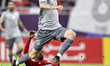 Rafa Mujica of Al Sadd SC and Musaab Khidir Mohamed of Al-Shamal SC compete during the Ami...