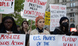 Thousands of people from a coalition of unions, activist groups, and supporters march in d...
