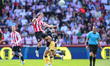 Yehor Yarmoliuk of Brentford heads the ball while challenged by Pablo Felipe of West Ham U...