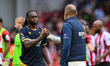 Nuno Espirito Santo, manager of West Ham United, shakes hands with Aaron Wan-Bissaka of We...