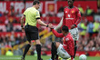 Referee Darren England assists Casemiro of Manchester United during the Premier League mat...