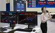The closing price of the KOSPI is displayed on a large electronic board at the Korea Excha...