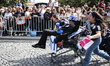 Finalists from Porto's higher education system, wearing different colored top hats and wal...