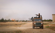 Vehicles and heavy weapons used by Syrian opposition fighters in combat against ISIS in Al...