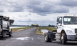 An agricultural plane takes off on a narrow strip between flooded rice fields after being...