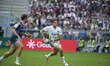 Santiago Carreras runs with the ball under pressure from Damian Penaud during the Investec...