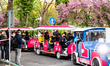 Members of the Visma - Lease a Bike pro cycling team ride a tourist train on the way to th...