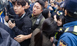 South Korean police officers detain members of the Korea Alliance of Progressive Students...