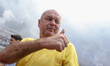 Persib Bandung coach Bojan Hodak approaches supporters, known as Bobotoh, after a training...