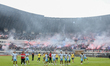 Persib Bandung players train as supporters, known as Bobotoh, show their support at the Ge...