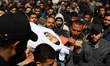 (EDITOR'S NOTE: Image depicts death) Mourners carry the body of Azzam Khalil al-Hayya, son...
