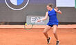 Catherine McNally of the United States competes against Iga Natalia Swiatek of Poland duri...
