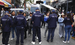 Members of the Argentine Federal Police and agents of the National Directorate of Migratio...