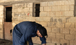 Sheep shearers work in the village of Kani Panka, located in the Sayid Sadiq district, Ira...