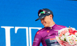Paul Magnier celebrates winning the purple jersey on the podium after the first stage of t...