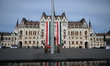 The Hungarian flag is raised on Kossuth Square in Budapest, Hungary, in front of the Hunga...