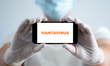 A Hantavirus sign is seen on a smartphone screen in Krakow, Poland, on May 10, 2026. Typic...
