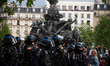 A squad of the French police CRS is seen at Place Nation during the Labour Day demonstrati...