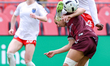 Evelyn Badu of AFC Toronto jumps on top of Zoe Burns of Montreal Roses to win the ball dur...