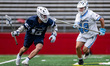Jack Iannantuono of the Penn State Nittany Lions drives the ball against Parker Sorenson o...