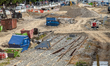 Construction machinery stands at a railway construction site for bomb disposal work at Mun...