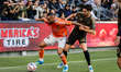 Guilherme #20 of Houston Dynamo and Stephen Eustaquio #46 of Los Angeles FC compete for th...