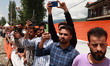 People take pictures with cellphones as thousands participate in the Nasha Mukt Abhiyaan,...