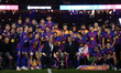 Barcelona president Joan Laporta celebrates celebrates with the trophy after winning the L...