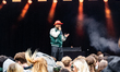 Host Ali Jassem onstage during the Last Day of School Festival 2026 at Faelledparken in Co...