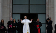 Pope Leo XIV waves next to Italian Cardinal Baldassare Reina and Antonella Polimeni, recto...