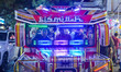 Tourists board a bus decorated with colorful lights on Braga Street in Bandung, West Java,...