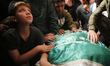 Mourners attend the funeral of Ezzedine Al-Haddad, identified as the chief of the Qassam B...