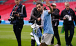 Bernardo Silva of Manchester City holds the FA Cup trophy during the Emirates FA Cup Final...