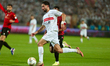 Zamalek player Ady El-Dabbagh (in white) challenges a player from USM Alger during the CAF...