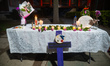 Candles are seen during a vigil and mass in honor of femicide victims at the Faculty of En...