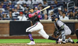 Mark Vientos of the New York Mets grounds out as Bo Bichette scores during the seventh inn...
