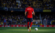 An Olympiacos F.C. player warms up before the match between AEK Athens and Olympiacos F.C....