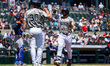 Coby Morales and Garrett Martin of the Somerset Patriots celebrate a home run during a Min...