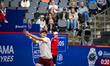 Alex de Minaur of Australia plays a forehand shot to Francisco Cerundolo during their Men'...