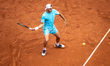 Francisco Cerundolo of Argentina plays a forehand against Alex de Minaur of Australia duri...