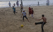 Children play soccer at Fort Kochi beach in Kochi, India, on May 18, 2026. 