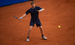 Yannick Hanfmann of Germany returns a forehand shot to opponent Max Schoenhaus of Germany...