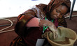 A woman creates traditional Algerian pottery at the 25th edition of the International Tour...