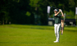 Victor Perez of France takes his second shot from the fairway on the 13th hole during the...
