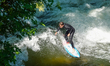 A surfer rides the Eisbachwelle in Munich, Bavaria, Germany, on May 22, 2026. The standing...
