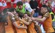 Hull City players surround Oliver McBurnie after he scores a late goal during the Sky Bet...