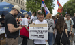 Students and opposition supporters gather on Bulevar Kralja Aleksandra before the start of...