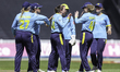 Warwickshire County Cricket Club players celebrate taking the wicket of Sophie Luff of Som...