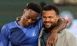 Gael Monfils hugs Jo-Wilfried Tsonga during a ceremony honoring Tsonga's career on day 2 o...